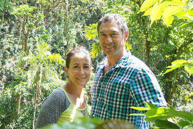The Hartmann family standing on the coffee farm