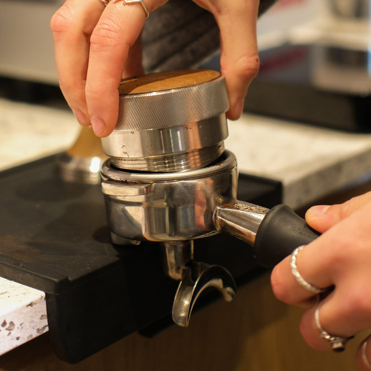 Coffee being tamped ready for espresso